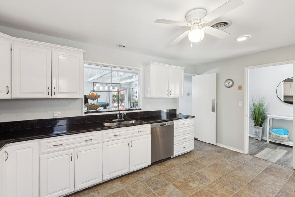 Fully equipped kitchen with stainless steel appliances.