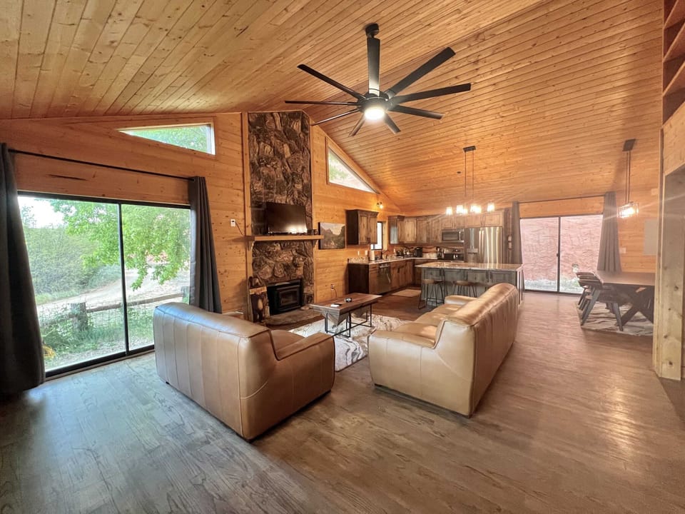 Living area at Zion Cliffs with full kitchen and flat screen TV