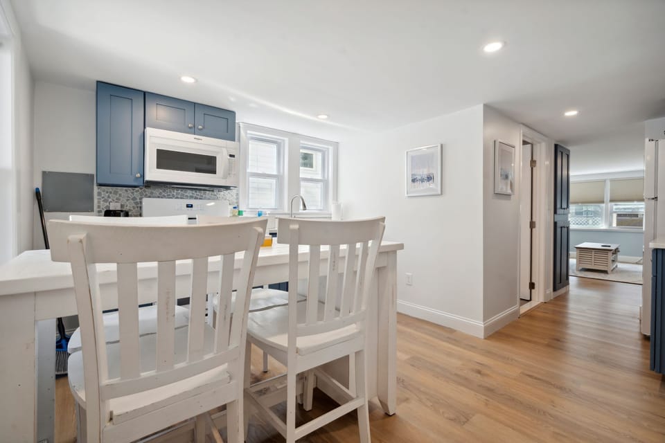 The newly renovated kitchen! New appliances and cabinets all around. This fully equipped kitchen has seating for 4 at the kitchen table (no dishwasher)