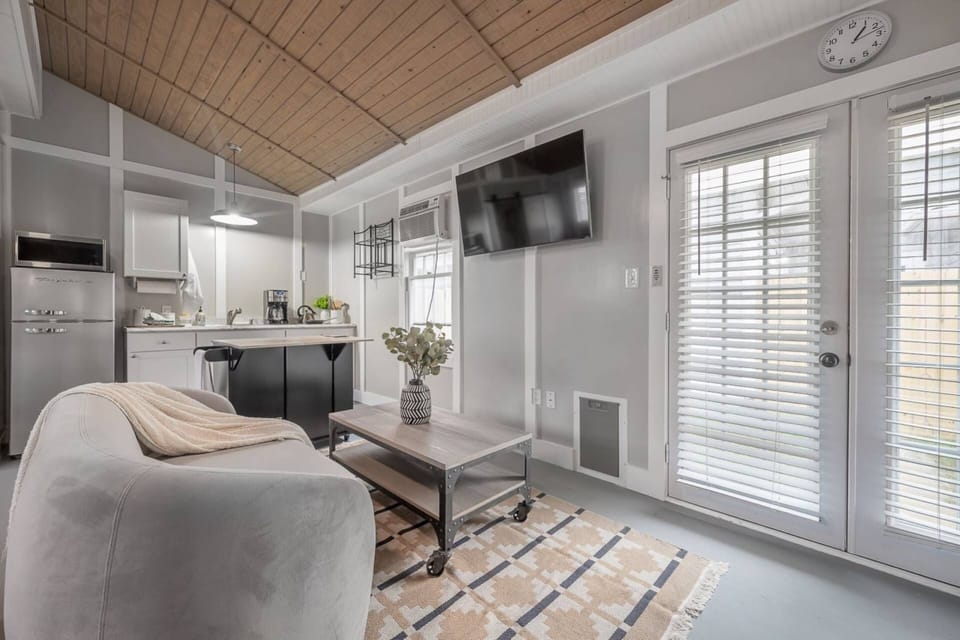 Vaulted ceilings and natural light make this cozy interior the perfect place to relax and unwind