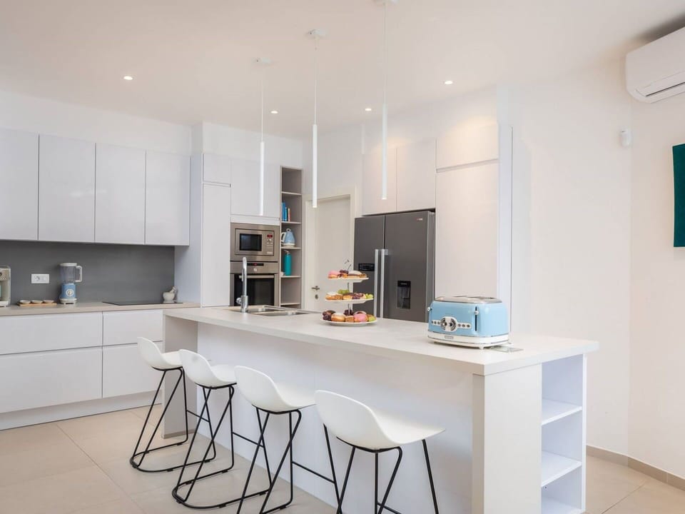 Furniture, Interior Design, Flooring, Kitchen, Wood, Countertop, Floor, Cabinetry, Kitchen Appliance, Ceiling