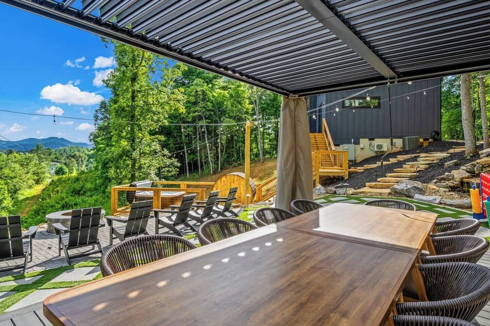 Dine al fresco on our expansive patio, surrounded by lush greenery and mountain views.