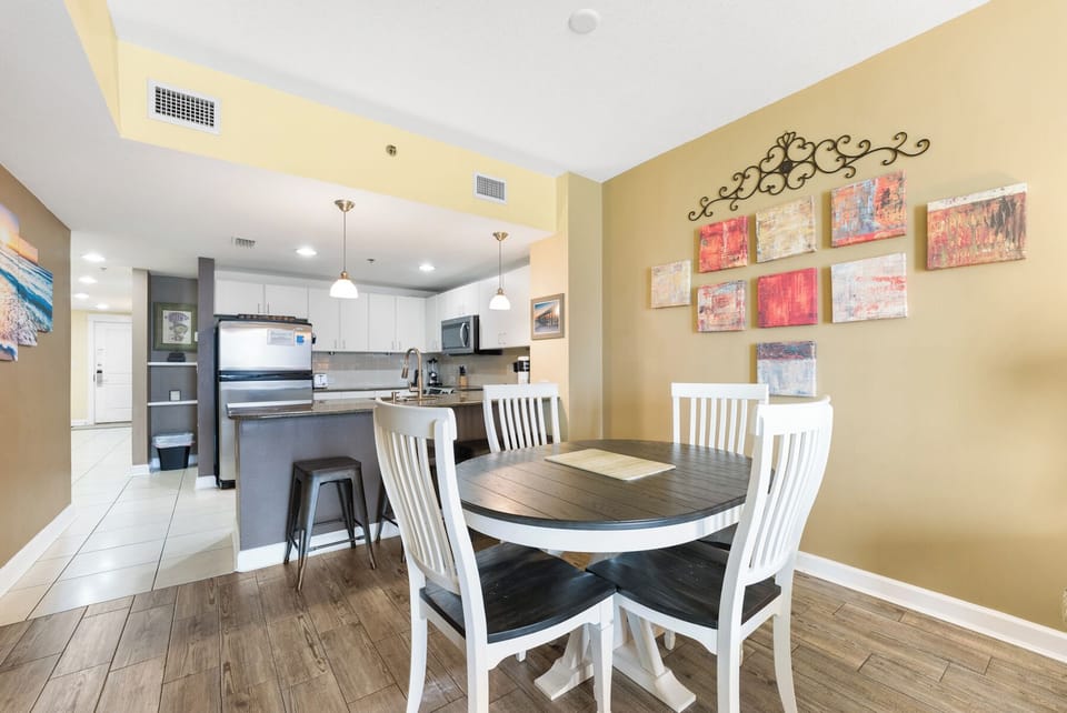 Gather around your stylish dining table while meals simmer on the modern kitchen island—perfect for memorable vacation conversations.