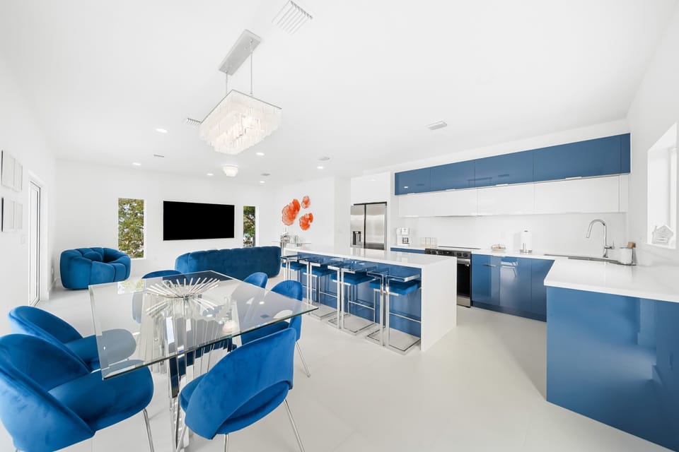 Vibrant blue accents and sleek design create a lively culinary haven!