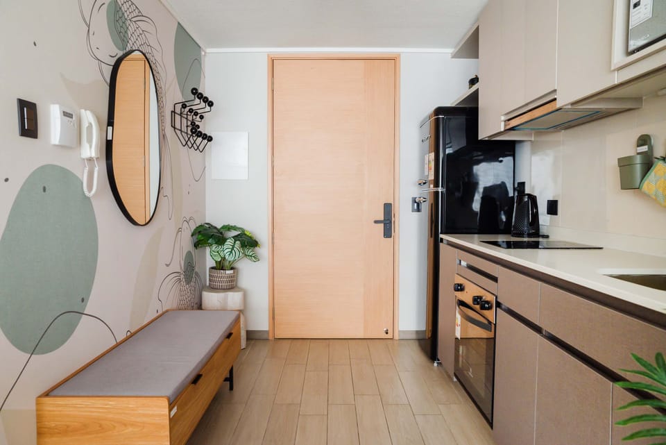 Stylish kitchen with modern appliances and chic decor, perfect for a cozy culinary experience.