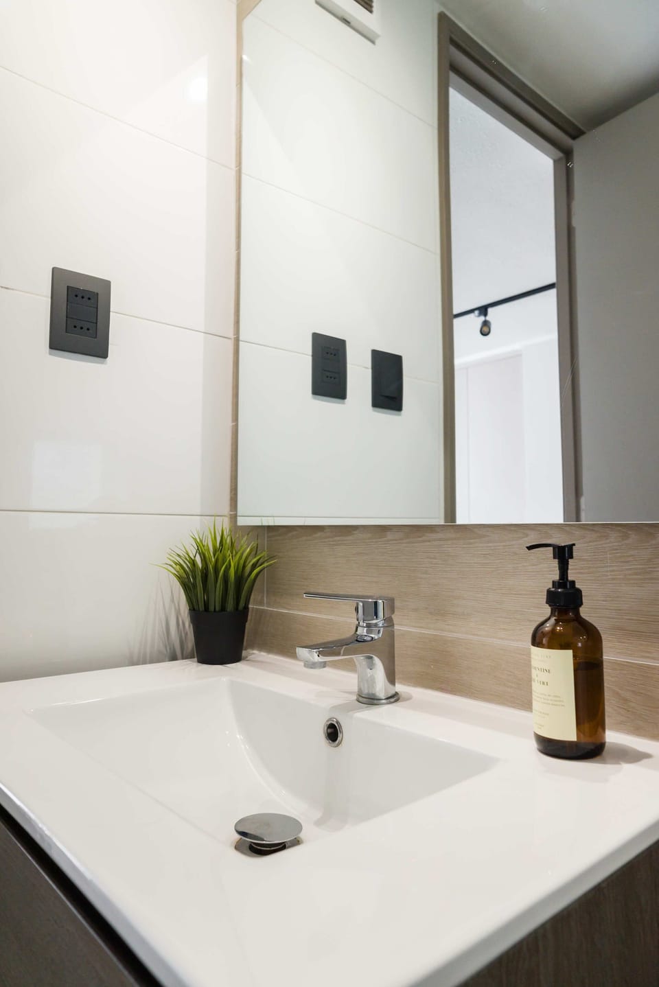 Stylish and modern bathroom with sleek fixtures and a refreshing ambiance, perfect for a rejuvenating start to your day.