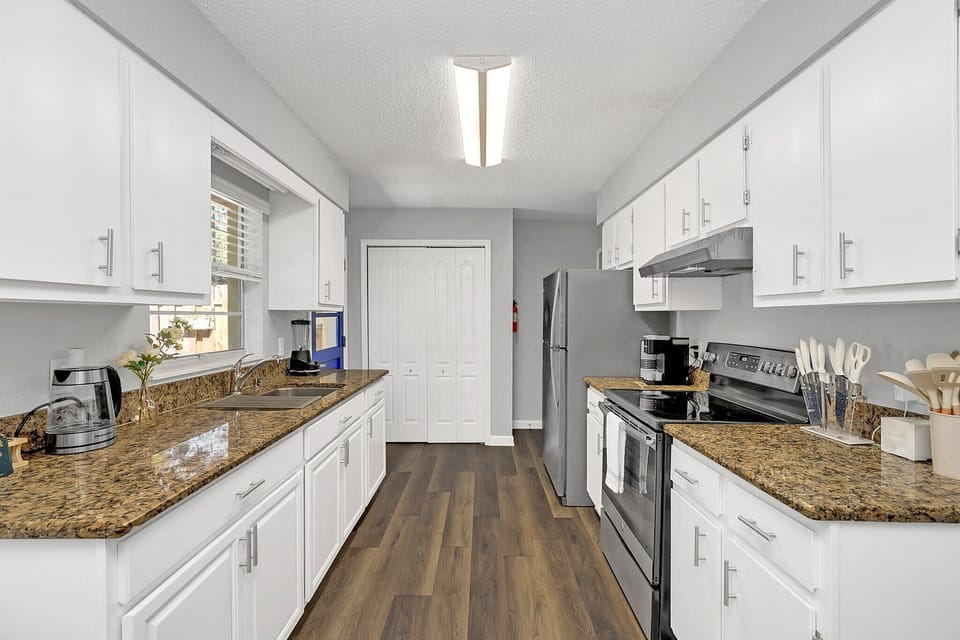 Modern kitchen with granite countertops and stainless steel appliances