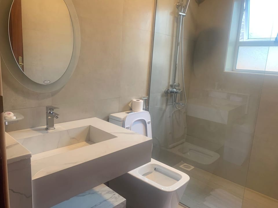 Shower, bathrobes, slippers, towels