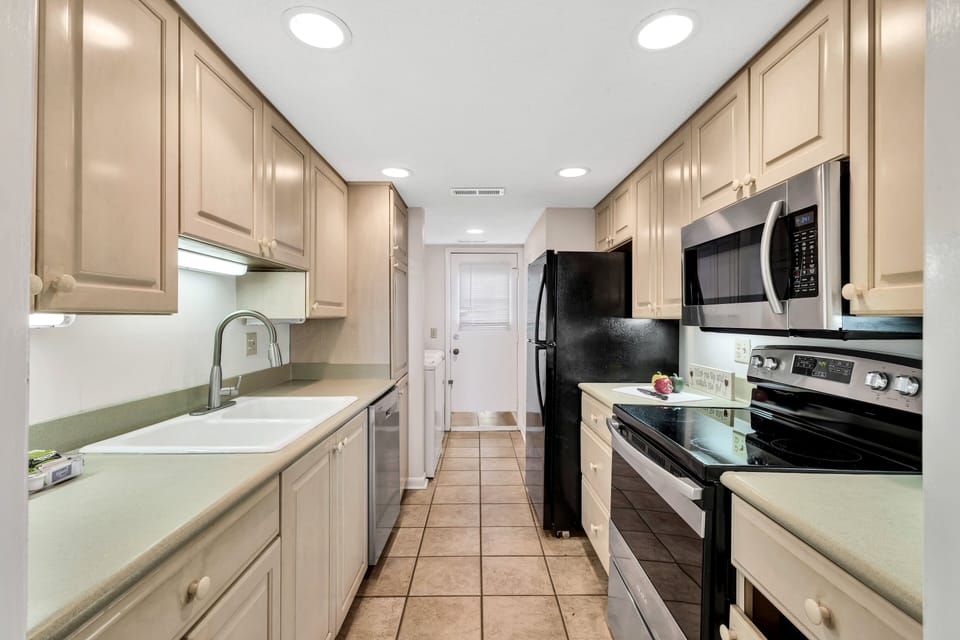 Fully Equipped Kitchen:  Modern Amenities andCozy Dining with a view.
