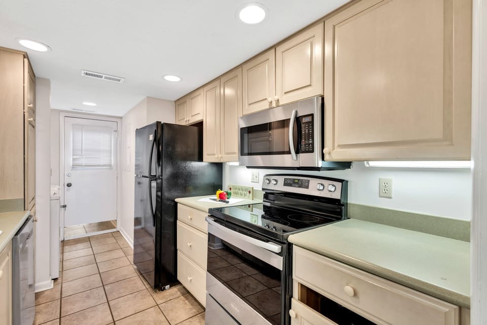Fully Equipped Kitchen:  Modern Amenities andCozy Dining with a view.