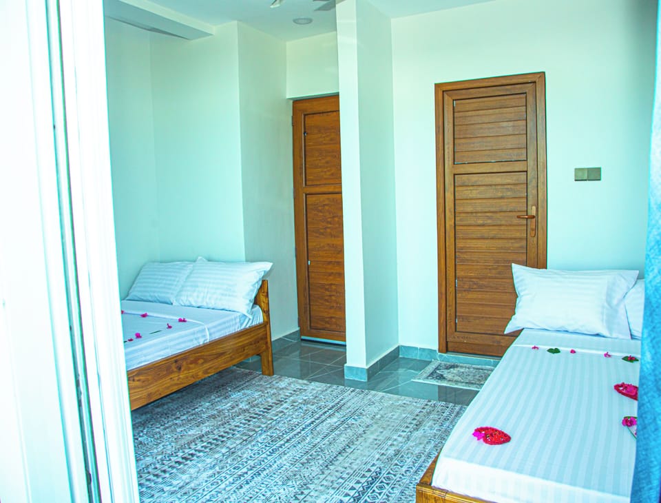 Deluxe Twin Room, Partial Sea View | In-room safe, laptop workspace, blackout drapes, WiFi (free)