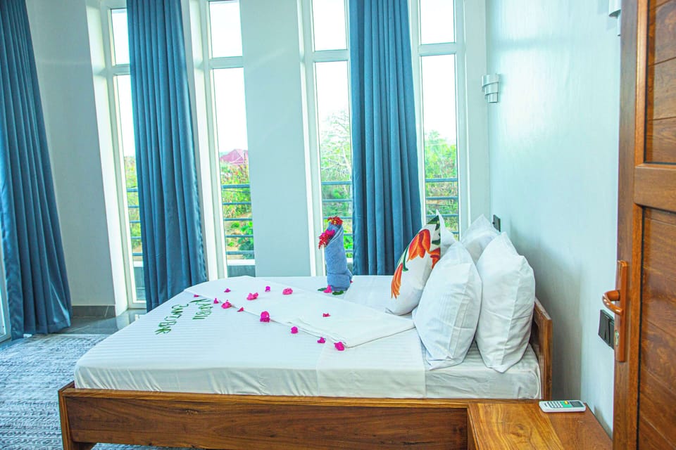 Deluxe Double Room, Balcony, Pool View | In-room safe, laptop workspace, blackout drapes, WiFi (free)