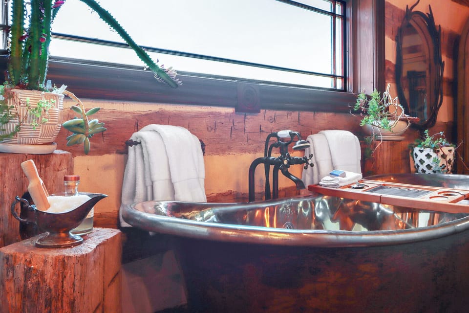 The bathroom 1 features a bath tub as well as a walk-in shower