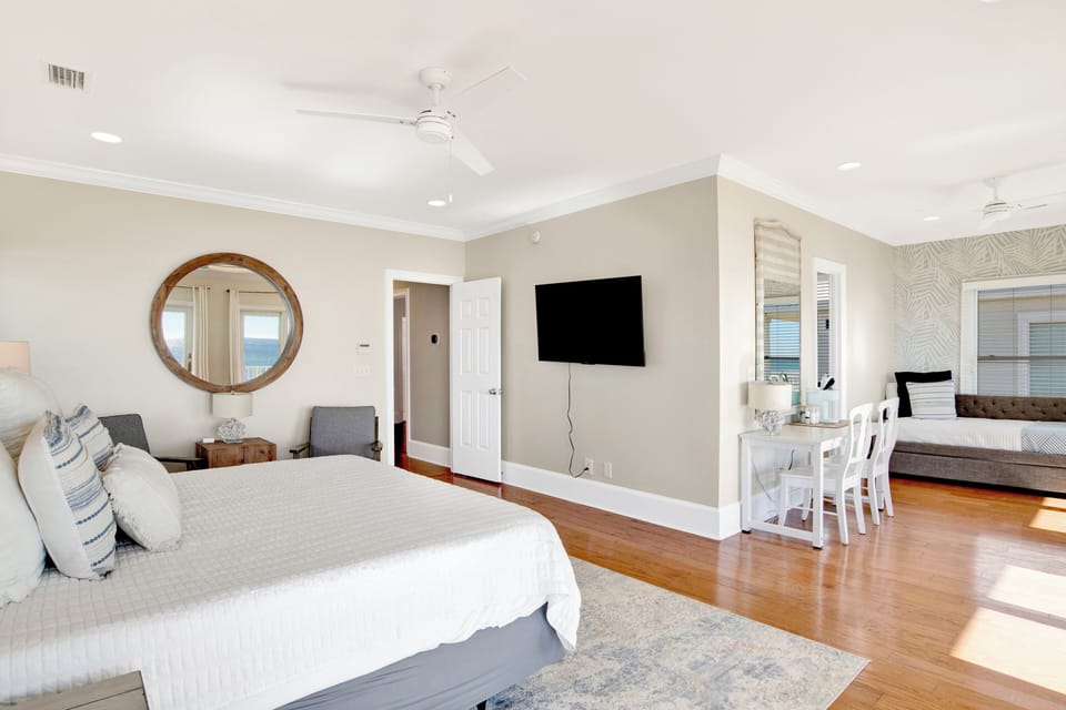 Bedroom 3 comes with a TV, desk, Keurig, and balcony access