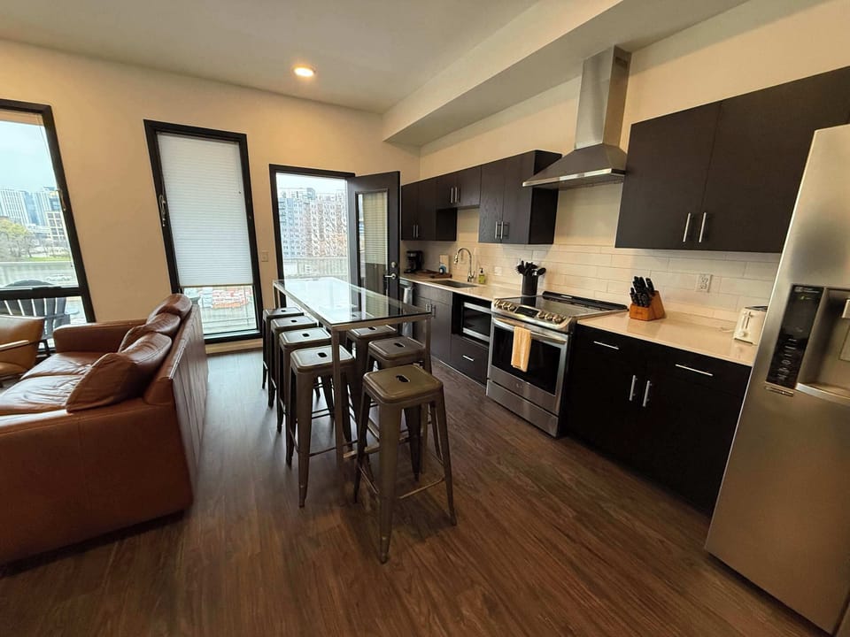 The stylish open kitchen offers ample space & every home comfort