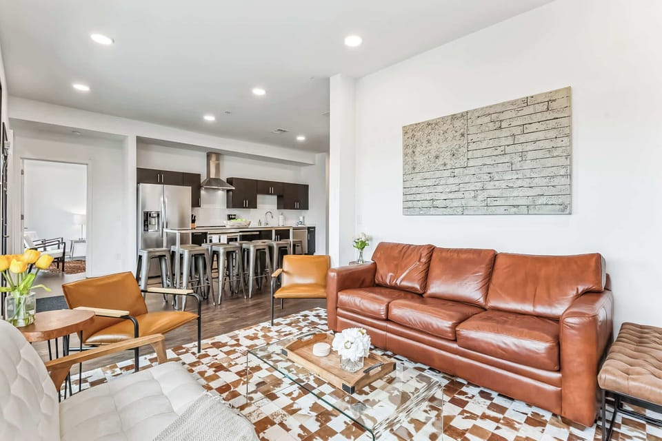 Unwind in the stylish living room & stream your favorites on the smart TV