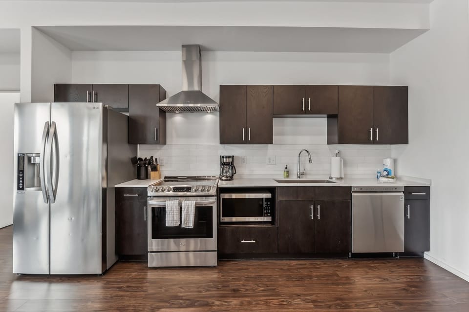 The modern, open kitchen offers ample space & every home comfort