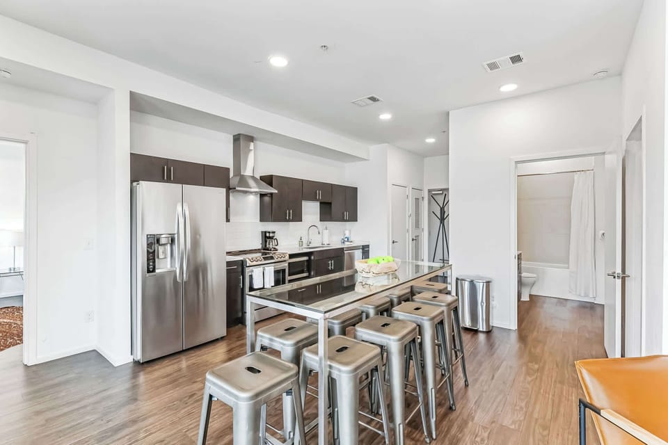 The modern, open kitchen offers ample space & every home comfort