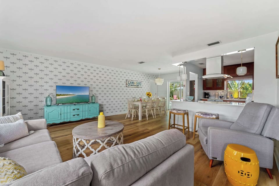 Step into this bright and airy coastal-themed living, where relaxation meets elegance. With its inviting decor, natural light, and beach-inspired accents, this space is perfect for unwinding or hosting gatherings with family and friends