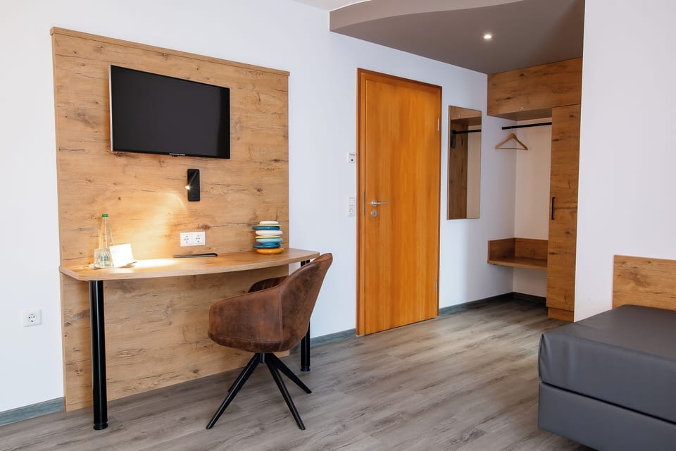 Premium bedding, desk, laptop workspace, soundproofing