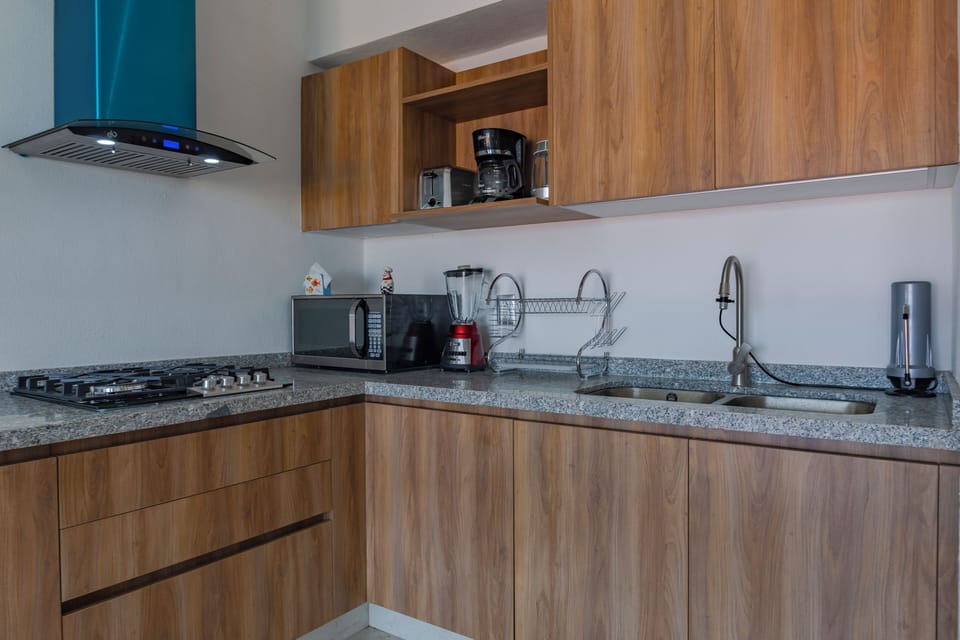 Deluxe Apartment, Balcony, Pool View | Private kitchen | Electric kettle