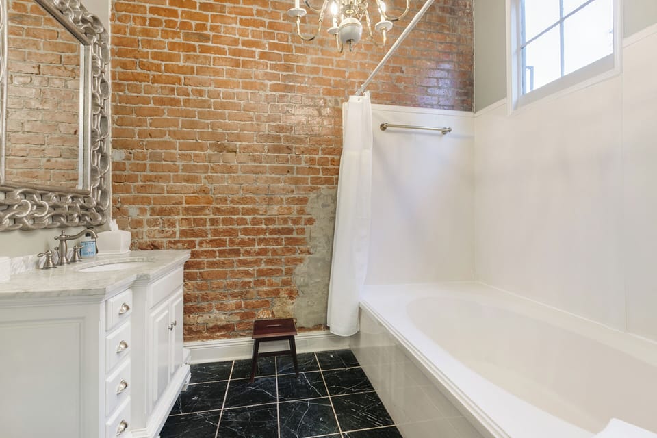 Bathroom with a large tub and modern amenities