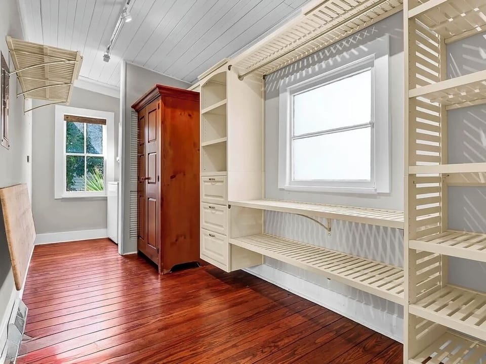 Downstairs Master Closet with Washer and Dryer located near back window