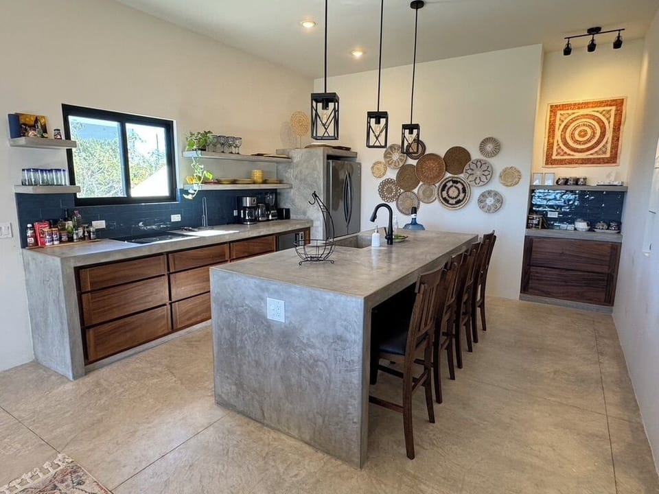 A fully stocked kitchen that has it all: large sink, blender, dishwasher, and easy-access drawers fo