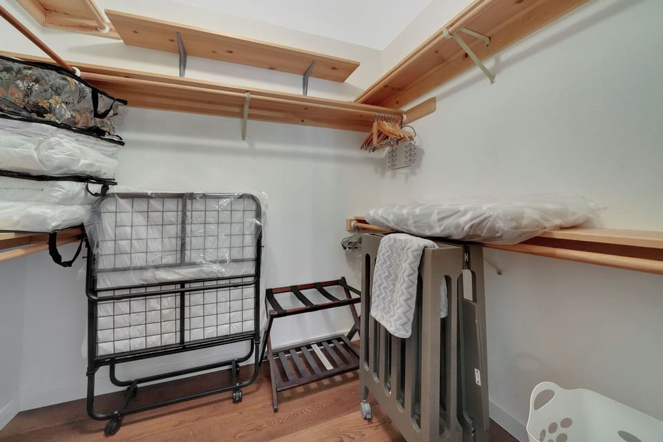 Master Bedroom Walk-in closet | Rollaway Folding Twin Bed | Mini Crib