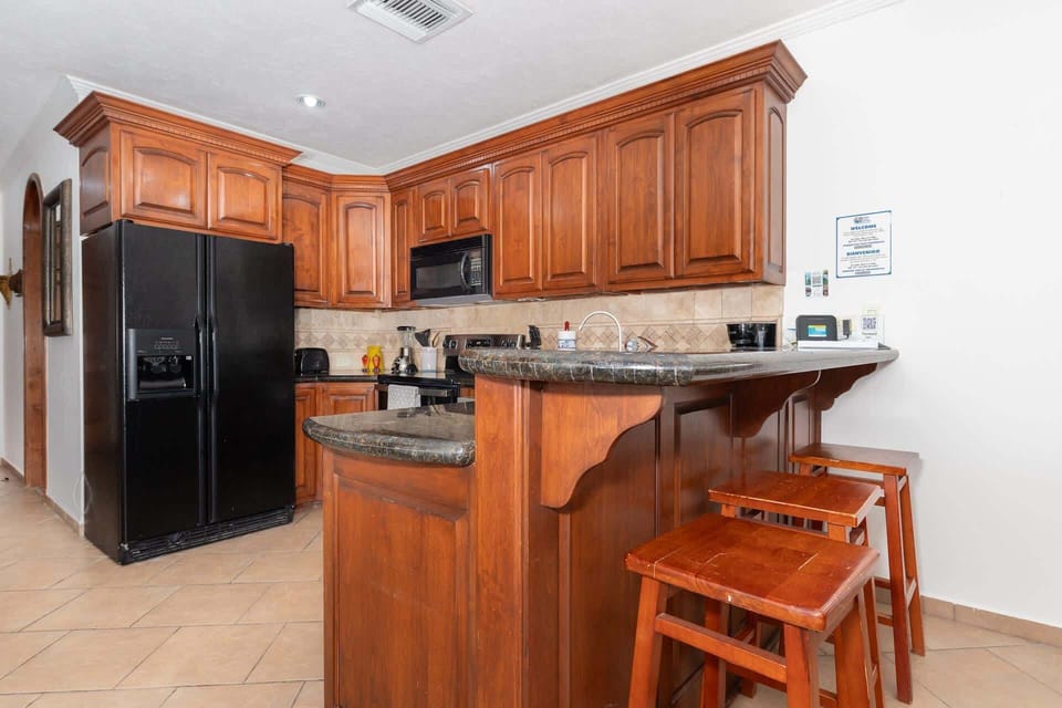  Everything you need to prepare meals or snacks—from cookware and appliances to a dining space with seating for the whole group.