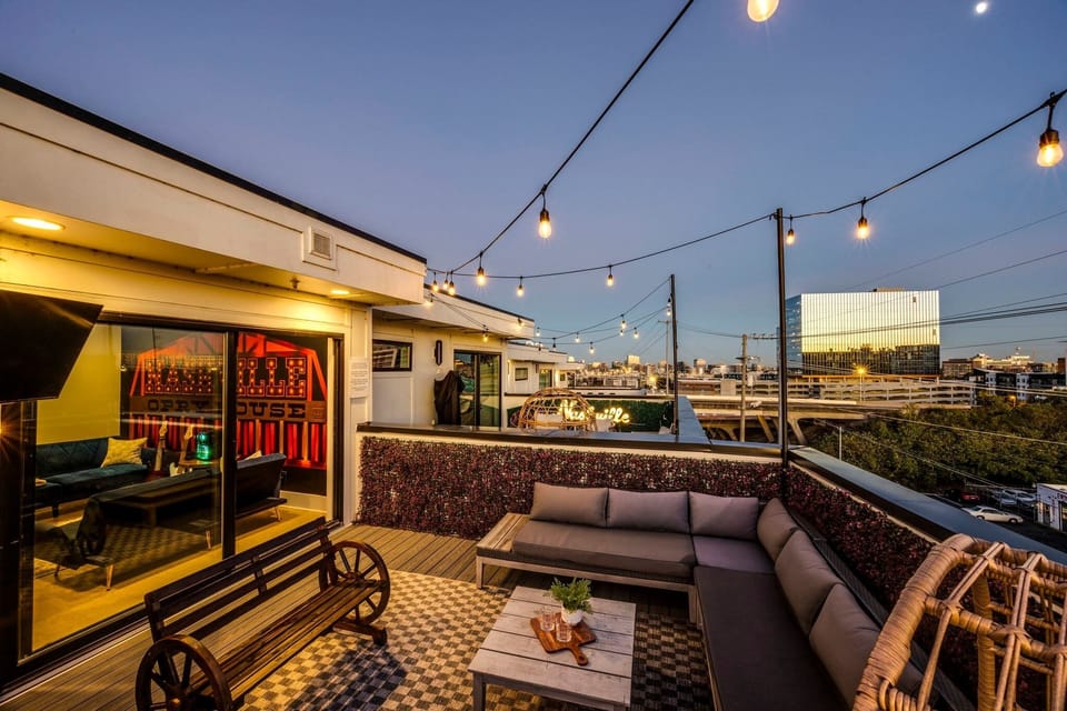 Rooftop retreat with stunning views, outdoor TV, and cozy seating—perfect for evenings under the stars. - The Opry - Nashville, TN