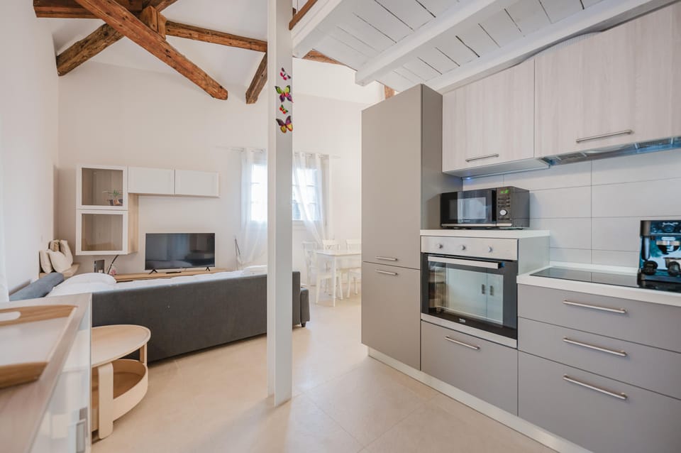 Comfort Condo | Private kitchen | Stovetop, espresso maker, electric kettle, cookware/dishes/utensils