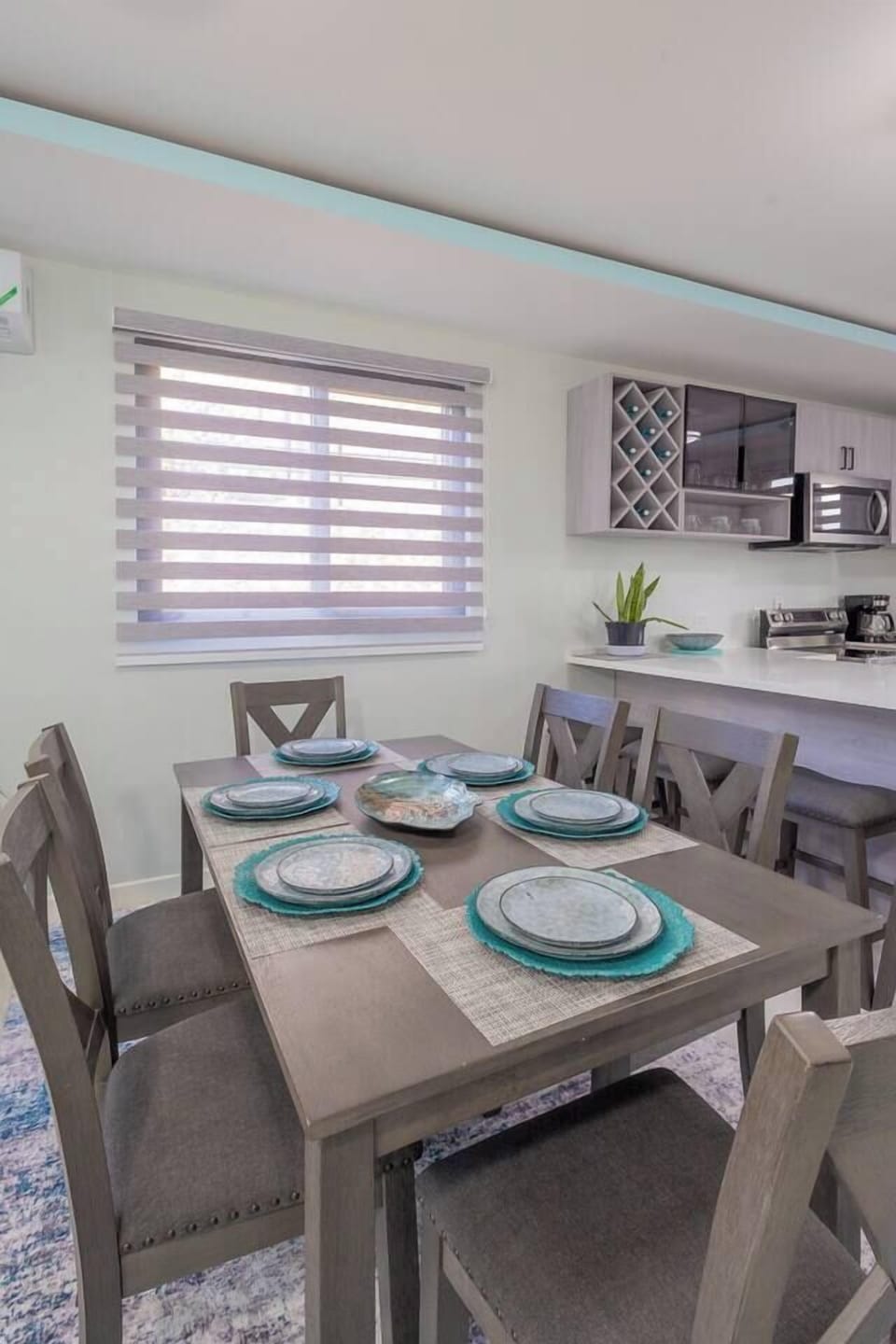 Dining area with six person dining table plus bar seating 