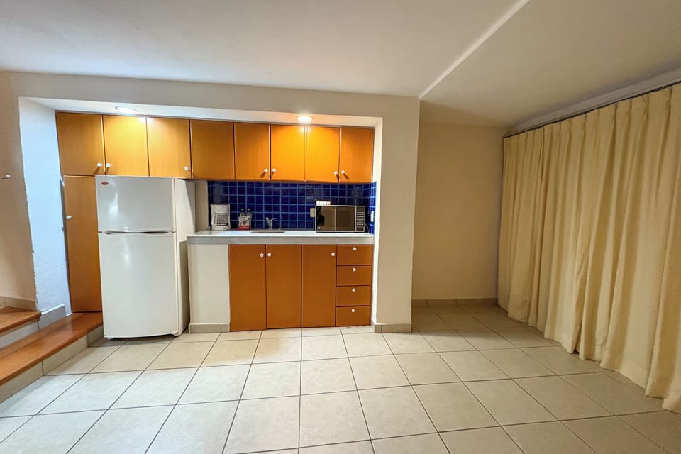 Full-size fridge, microwave, coffee/tea maker, dining tables