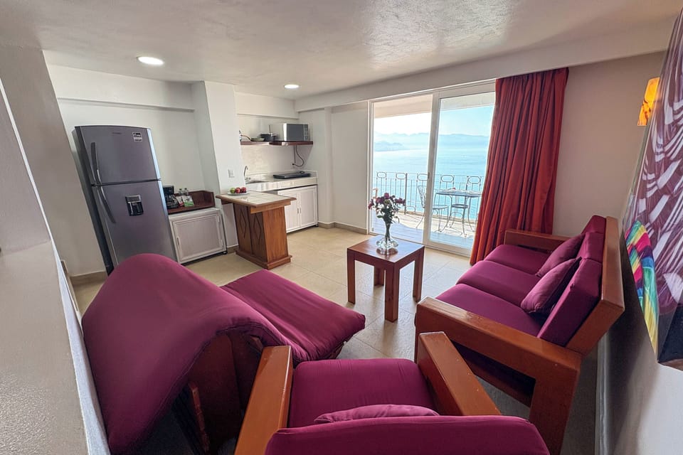 Premium Condo, Balcony, Sea View | Private kitchen | Full-size fridge, microwave, coffee/tea maker, dining tables