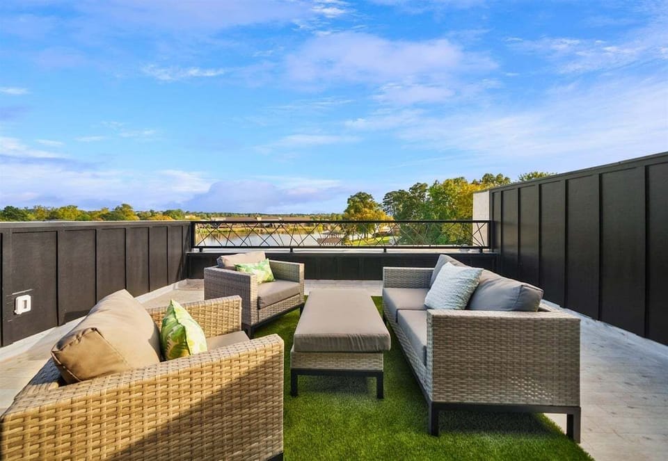 Step outside to this inviting seating area, where you can sip your morning coffee, enjoy a good book, or watch the sunset with stunning lake views as your backdrop.