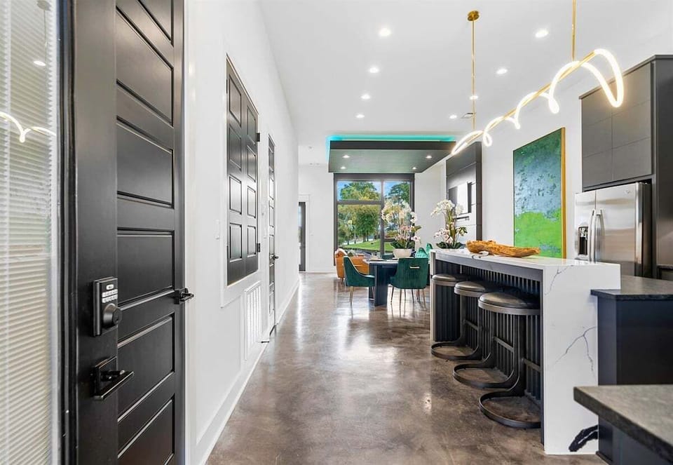 A warm, inviting entryway leads you into the heart of the home, with elegant details and an open layout that sets the tone for your stay.