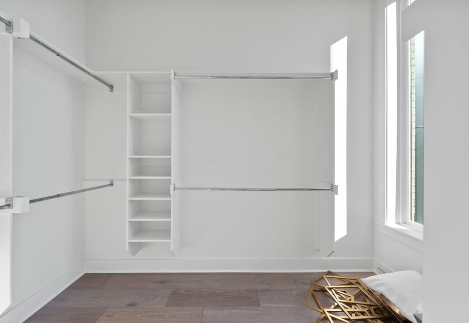 A spacious walk-in closet offering ample storage space to keep your belongings organized, ensuring a clutter-free and comfortable stay.