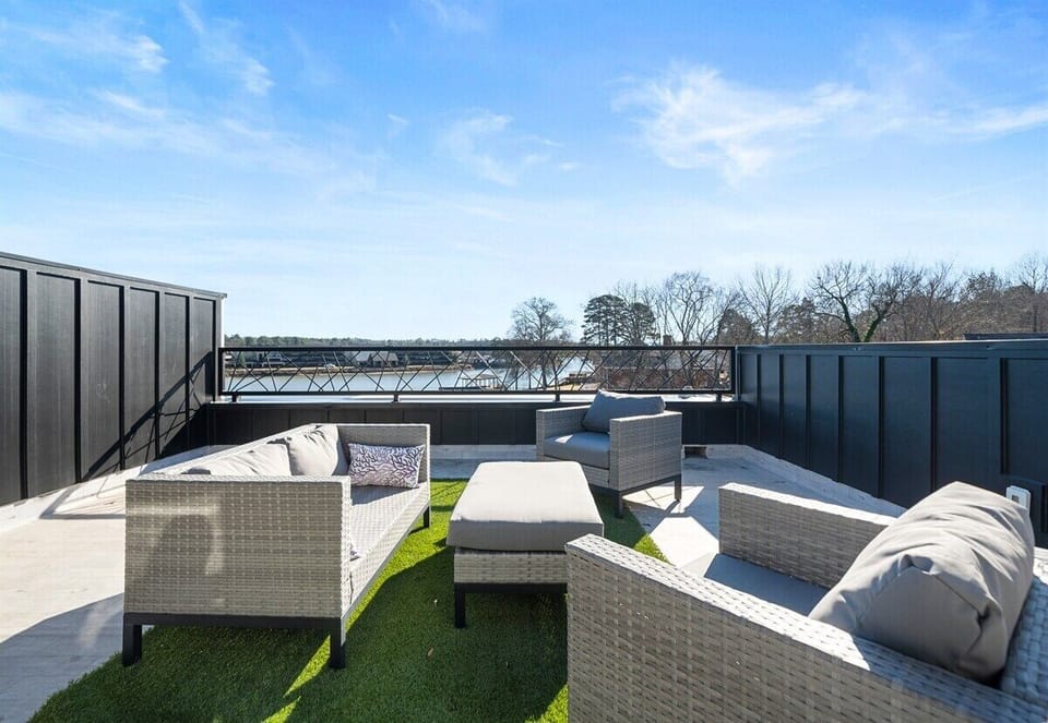 Step outside to this inviting seating area, where you can sip your morning coffee, enjoy a good book, or watch the sunset with stunning lake views as your backdrop.