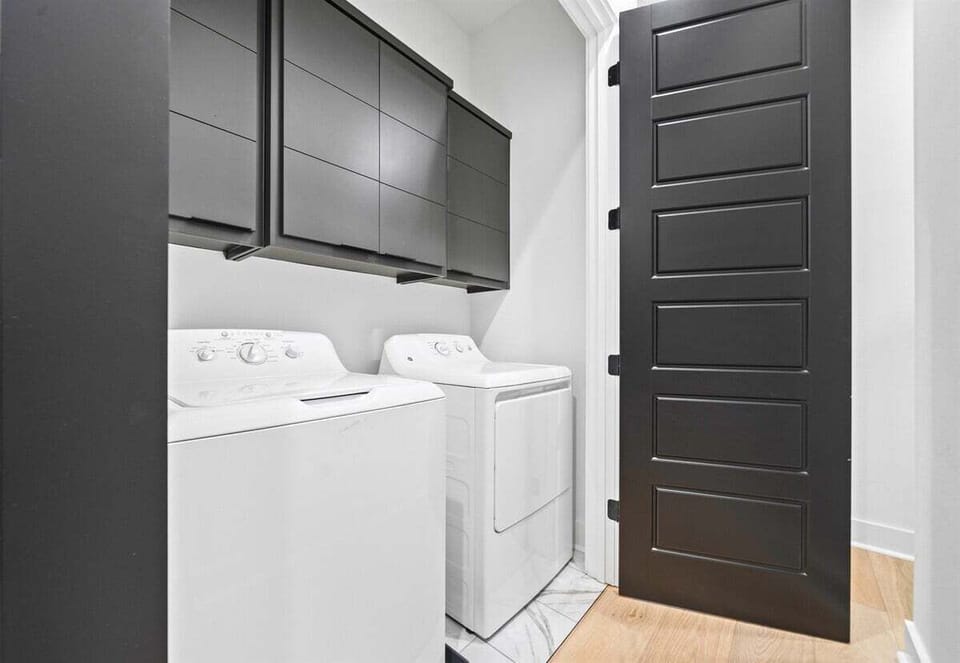 The laundry area offers modern appliances and plenty of space, ensuring your stay is as convenient and comfortable as possible.