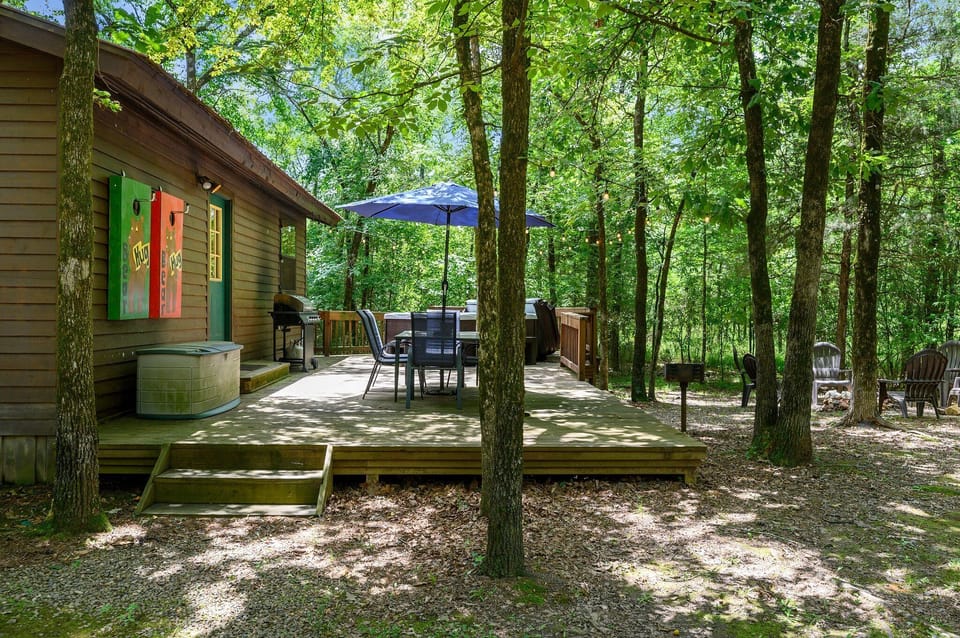 Patio with outdoor dining and hot tub