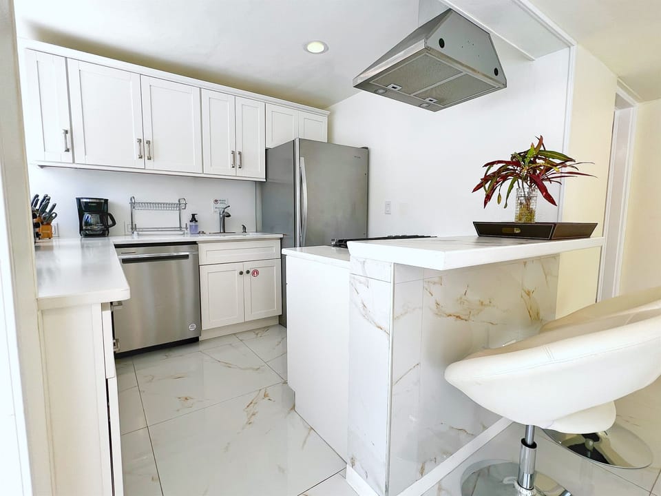 Spacious countertops and sleek design create the ultimate vacation kitchen.