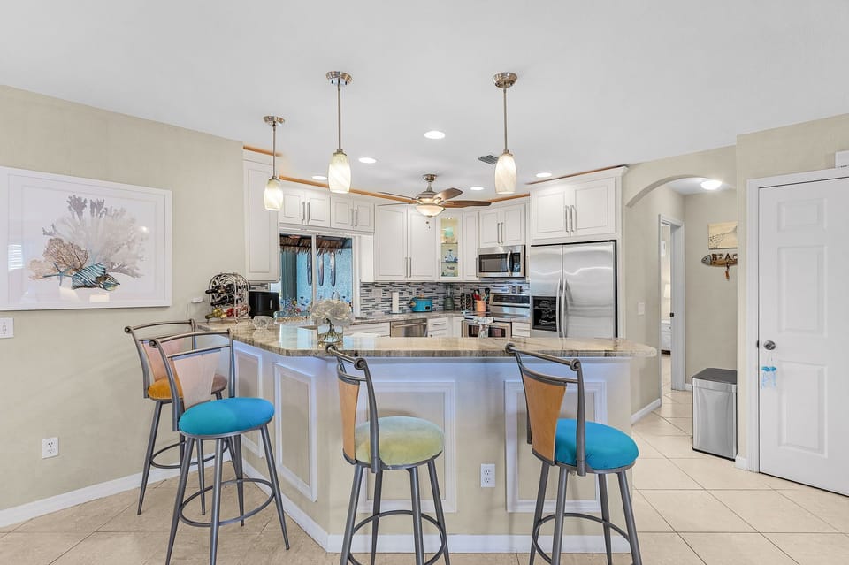 Complete kitchen with cookware, utensils and spices.