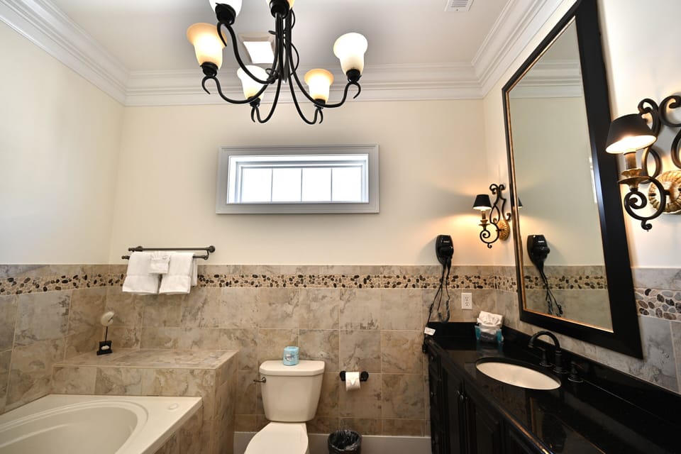 Stylish primary bathroom boasting a double marble vanity and premium finishes.