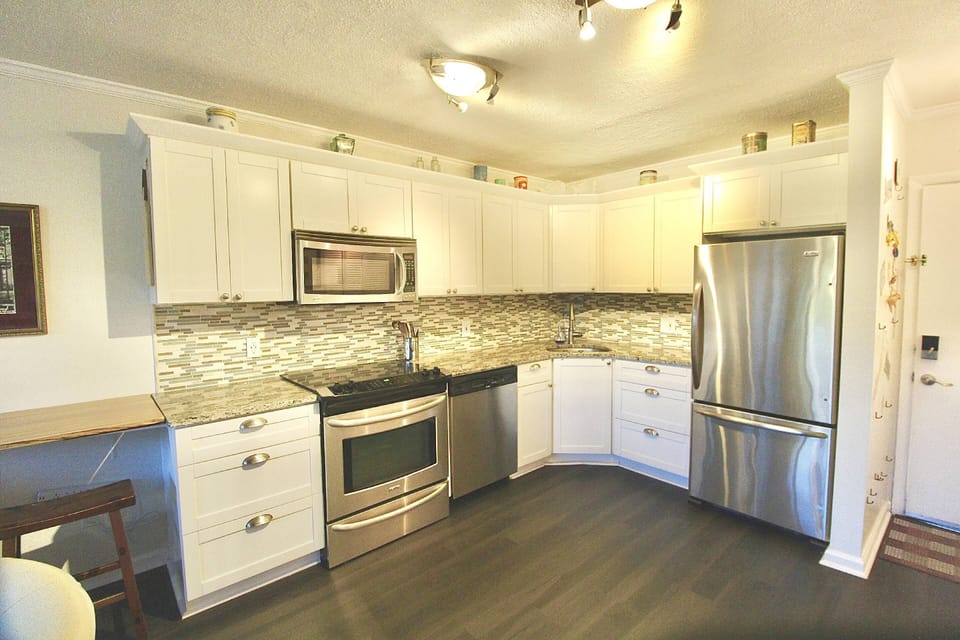 The upgraded kitchen boasts stainless steel appliances and plenty of space to prep and cook.