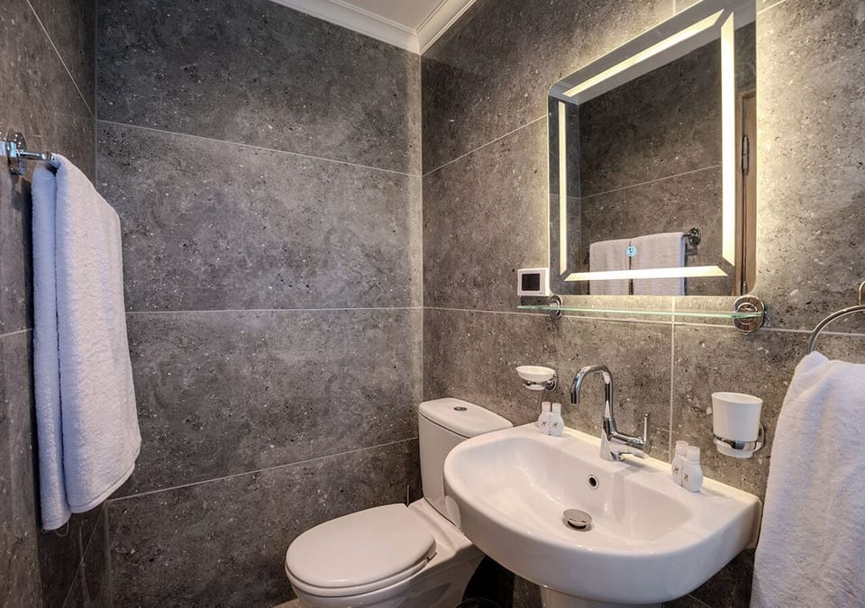 Separate tub and shower, hair dryer, towels, soap