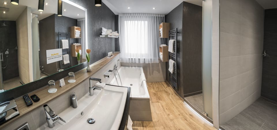 Suite, 1 King Bed | Bathroom | Free toiletries, hair dryer, slippers, towels