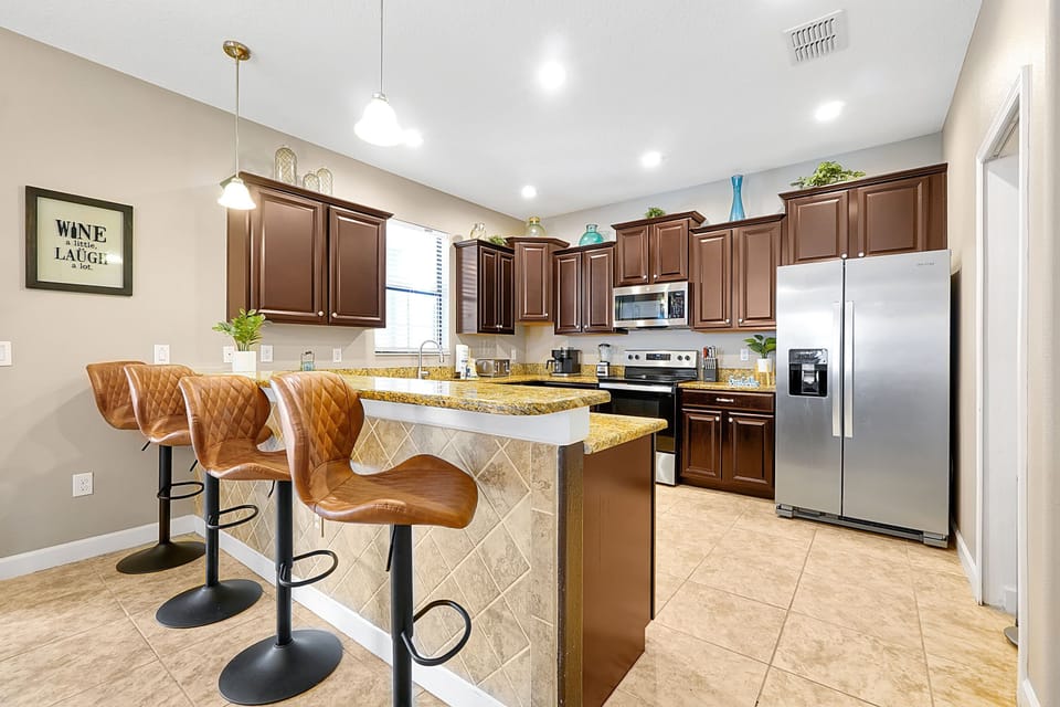 Casual seating for quick meals at the breakfast bar, featuring stylish, comfortable stools.