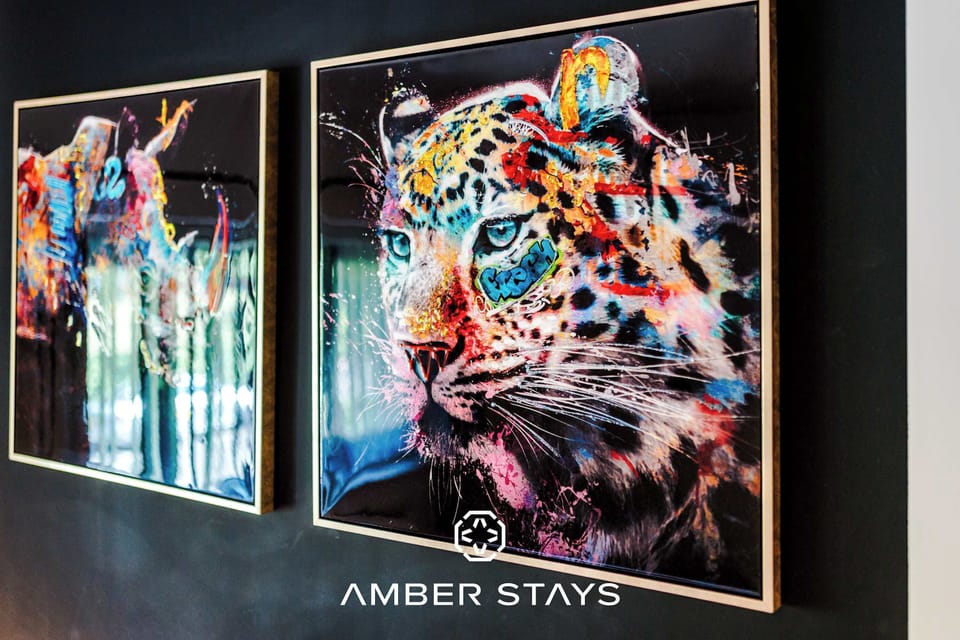 This striking abstract wall art adds a bold and creative touch to the home’s interior. 