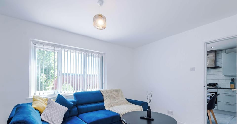 A bright and welcoming living room with comfortable seating, soft lighting, and thoughtful décor. The open layout creates a perfect space for relaxing, entertaining, or enjoying quiet moments
